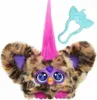 A close-up studio shot of a Furby Furblet toy with leopard print fur, pink hair, and large blue eyes. Produktbild-Vorschau
