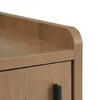 A close-up view of the top corner of a wooden cabinet with a black handle. Produktbild-Vorschau