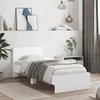 A white bed frame with a headboard, neatly made with bedding and a blanket, in a minimalist bedroom setting. Náhľad obrázku produktu