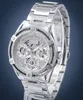 A silver Guess watch with diamond accents is displayed against a blue background. Voir les images du produit