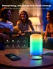 People playing music and a colorful LED lamp on a table. Produktbild-Vorschau