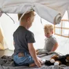 Two young boys playing inside a tent. Produktbild-Vorschau