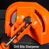 A close-up of an orange drill bit sharpener with a drill bit inserted. Podgląd zdjęcia produktu