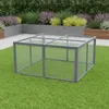 A wire mesh enclosure with a clear top sits on a green lawn, with planters and foliage in the background. Anteprima dell’immagine prodotto