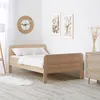 A bedroom scene with a bed, dresser, and wall art. Náhled obrázku produktu