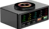 A black multi-port USB charging hub with a wireless charging pad on top, displaying real-time power output on multiple screens. Produktbild-Vorschau