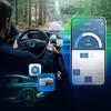 A person driving a car, with a smartphone app displaying temperature and battery information, and icons representing Bluetooth and a battery pack. Náhled obrázku produktu