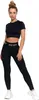 A woman is posing in a black athletic outfit. Produktbild-Vorschau