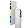 Two silver USB-C hubs are shown against a white background. One hub is in the foreground, and the other is behind it and slightly to the left. Produktbild-Vorschau