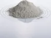 A pile of fine gray powder on a clear circular mat with concentric circles, on a white background. Produktbild-Vorschau
