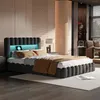 A modern bedroom with a bed, nightstand, and chair. Náhled obrázku produktu