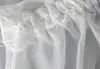 A close-up view of the top hem of a white sheer curtain, showing the gathering and stitching. Produktbild-Vorschau