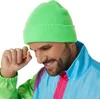A man wearing a neon green beanie and a colorful retro jacket. Produktbild-Vorschau