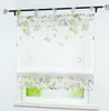 A floral patterned Roman blind is shown hanging on a window. Produktbild-Vorschau