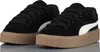 A pair of black Puma Creeper Phatty sneakers with white accents and a thick brown sole, displayed on a light gray reflective surface. Anteprima dell’immagine prodotto
