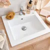 A white ceramic sink with a chrome faucet and drain. Anteprima dell’immagine prodotto