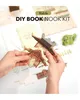 Hands assembling a wooden DIY book nook kit with traditional architectural elements. Náhled obrázku produktu