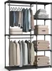 A freestanding wardrobe with hanging clothes and folded blankets. Produktbild-Vorschau