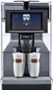 A silver and black automatic coffee machine with two glasses of latte macchiato being dispensed. Produktbild-Vorschau