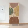 A wardrobe with a colorful abstract design in a room with two framed pictures on the wall. Anteprima dell’immagine prodotto