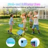 Children playing with bubbles in a grassy yard, with a house in the background. Produktbild-Vorschau