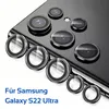 A close-up view of multiple camera lens protectors arranged on a black smartphone. Produktbild-Vorschau