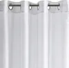 A close-up view of a white curtain with grommets. Produktbild-Vorschau