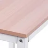 Close-up of the corner of a desk, showing the wood grain surface and white metal frame. Podgląd zdjęcia produktu