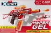 The image shows the packaging of a Zuru X-Shot Hyper Gel Trace Fire toy gun. Voir les images du produit