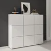 A white shoe cabinet with six compartments is shown against a dark gray wall and a white floor. Produktbild-Vorschau