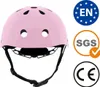 A pink helmet with safety certification logos on the side. Podgląd zdjęcia produktu