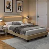 A bedroom scene with a bed, nightstands, and artwork on the wall. Náhľad obrázku produktu
