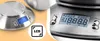 A collage of two images showing a digital kitchen scale. The left side shows a close-up of the scale with a blue LCD display and a circular stainless steel platform. An inset graphic highlights the LCD display. The right side shows a closer view of the sca Produktbild-Vorschau