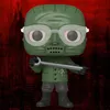 A Funko Pop! vinyl figure of The Riddler from The Batman movie, standing against a red and black textured background. Podgląd zdjęcia produktu