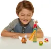 A young boy is looking at a set of Super Mario figures arranged on a table. Produktbild-Vorschau