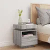 A bedside table next to a bed. Produktbild-Vorschau