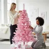 Two women decorating a pink Christmas tree in a living room. Produktbild-Vorschau