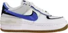 A side view of a white Nike Air Force 1 Shadow sneaker with blue and gray accents. Podgląd zdjęcia produktu
