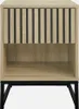A front view of a contemporary nightstand with a ribbed wood-look drawer front and an open shelf, supported by black metal legs. Produktbild-Vorschau