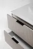 A close-up view of a beige bathroom vanity with two drawers, one partially open, against a white background. Anteprima dell’immagine prodotto