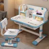 A child's desk and chair set with a space theme, set up in a room. Produktbild-Vorschau