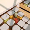 A top-down view of a kitchen drawer filled with clear food storage containers with white lids, containing various dry goods like pasta and what appears to be peas. A small glass bowl with red chili peppers is also visible. Produktbild-Vorschau