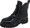 A black patent leather ankle boot with a platform sole and rainbow stitching. Produktbild-Vorschau