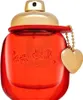 A red Coach perfume bottle with a gold top and a gold heart charm. Voir les images du produit