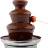 A chocolate fountain with a strawberry on a skewer. Podgląd zdjęcia produktu