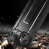 A black smartphone case with a kickstand is shown at an angle, with debris falling around it, suggesting durability. Produktbild-Vorschau