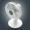 A close-up, overhead shot of a white table fan against a dark grey gradient background. Náhľad obrázku produktu