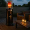 A gas patio heater is lit on a wooden deck at dusk, with chairs and a table nearby. Produktbild-Vorschau
