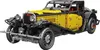 A yellow and black vintage-style car model made of building blocks, shown from a three-quarter front angle against a white background. Náhľad obrázku produktu