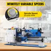 A blue and gray mini metal lathe is shown on a wooden surface with a blurred industrial background. Overlay text highlights features. Produktbild-Vorschau